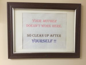 A sign mounted in the bathroom close to the dining area in the residential dome (Photo by Zachariah Hughes, Alaska Public Media - Anchorage