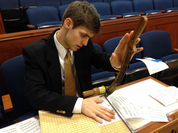 A page hard at work in the House Chamber. Photo by Annie Feidt, APRN - Anchorage.