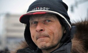 Martin Buser at the 2013 Iditarod ceremonial start in Anchorage. Photo by Patrick Yack, APRN - Anchorage.