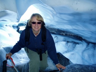 Kris Crossen standing inside an ice cave on the Bering Glacier.