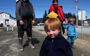 Two-year-old Lituya smiles for the camera outside the KBBI studios in Homer (Aaron Selbig photo)