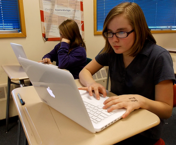 7th grade student, Madyson Sauer, works on her laptop in computer class. Photo by Angela Denning, KFSK - Petersburg.