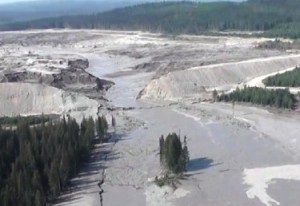 This aerial image from a British Columbia emergency office video shows the Mount Polley dam break and some of the damage downstream.