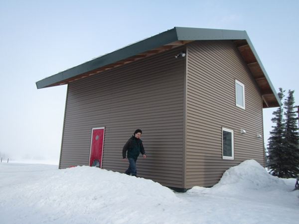 UAF Professor Tom Marsik, who now teaches at the Bristol Bay Campus, at his home in Dillingham. The 600-square-foot, extremely energy-efficient house has been certified as the world's most airtight house. (Credit KDLG)