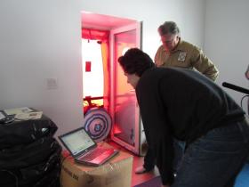 Marsik and friend Gordon Isaacs conduct a blower door test on Marsik's home in March 2013 to determine how tightly it's sealed. The test was certified by the World Record Academy, which declared the structure was "the world's most airtight house." (Credit KDLG)