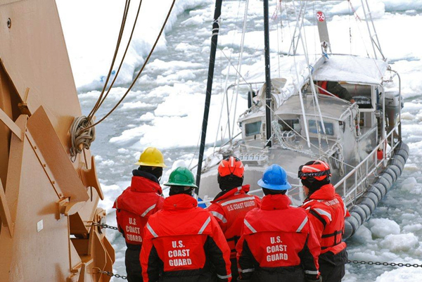 41 foot sailing vessel Altan Girl is towed out of the sea ice by USCGC Healy after getting stuck about 40 miles northeast of Barrow in July 2014. (Photo by Ensign Carolyn Mahoney, U.S. Coast Guard)