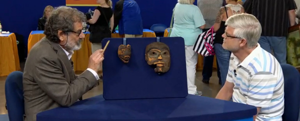 Appraiser Tim Trotta with the unidentified owner of the masks. (PBS Antiques Roadshow image.)
