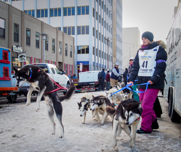 Willow musher Lisbet Norris prepares for the 2015 Iditarod ceremonial start. (Photo by Zachariah Hughes, KSKA - Anchorage)