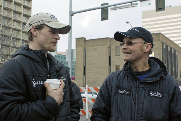 Dallas and Mitch Seavey talk before the ceremonial start of the 2015 Iditarod. (Photo by Josh Edge, APRN - Anchorage)