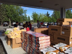 Volunteers help set up for the food pantry at Muldoon Community Assembly Church in Anchorage. Hillman/KSKA