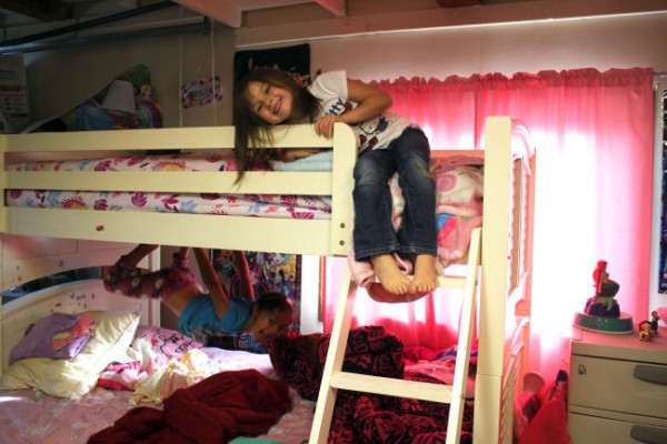 The Lohreys converted the garage into a bedroom that Kristyanna, 6, and Kylie, 5, share. (Photo by Lisa Phu/KTOO)