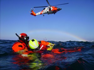 Rescue swimmers from Coast Guard Air Station Kodiak wait for a basket pickup by an MH-60 Jayhawk helicopter during open water training off the coast of Kodiak Island April 23, 2008. (Official USCG photo by PA1 Kurt Fredrickson) 