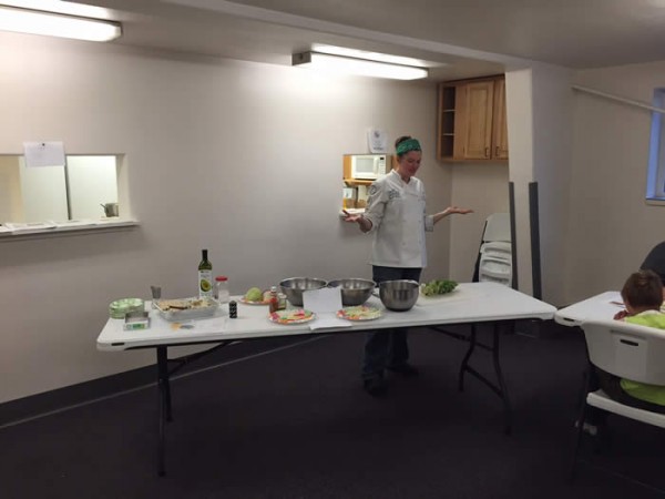 (Chef Danielle Flaherty prepares some brussel sprouts at a recent cooking demonstration at the Galena Pool)