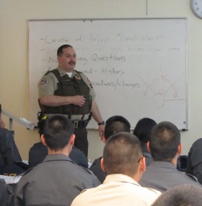 First Sergeant James Hoelscher instructs officers at a 2014 training. (Photo By Ben Matheson/ KYUK)