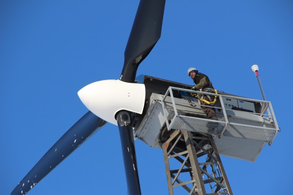 Mike Wassallie climbs a wind turbine in Kwigillingok to check the blades after a blizzard. Photo: Rachel Waldholz/APRN