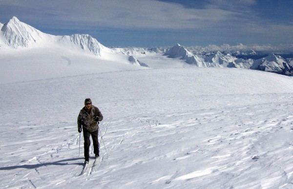 Chris Hanna, of Soldotna, skis on the Harding Icefield on Friday, April 8, 2016, with the Kenai Fjords and mountains surrounding Seward, on the Kenai Peninsula, in the background. (Photo courtesy of Jenny Neyman)