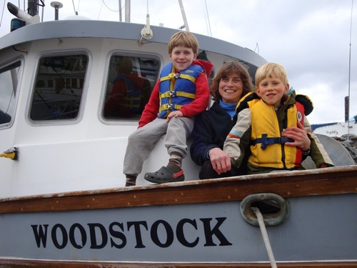Linda Behnken with her sons, Rio and Hahlen. Behnken lives the small-boat fishing life she advocates for, but she’s no stranger to IPHC politics. She’s chaired the 84-member IPHC Conference Board for the last several years. (ALFA photo by Mim McConnell)