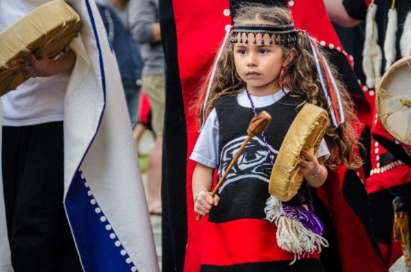 A young drummer at the grand entrance to Celebration 2014. (Photo by Heather Bryant/KTOO)