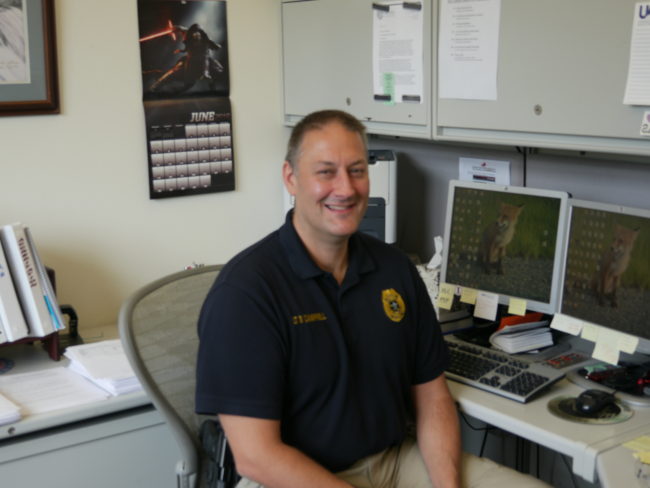 Juneau police Lt. David Campbell at his desk. (Photo by Quinton Chandler, KTOO - Juneau)