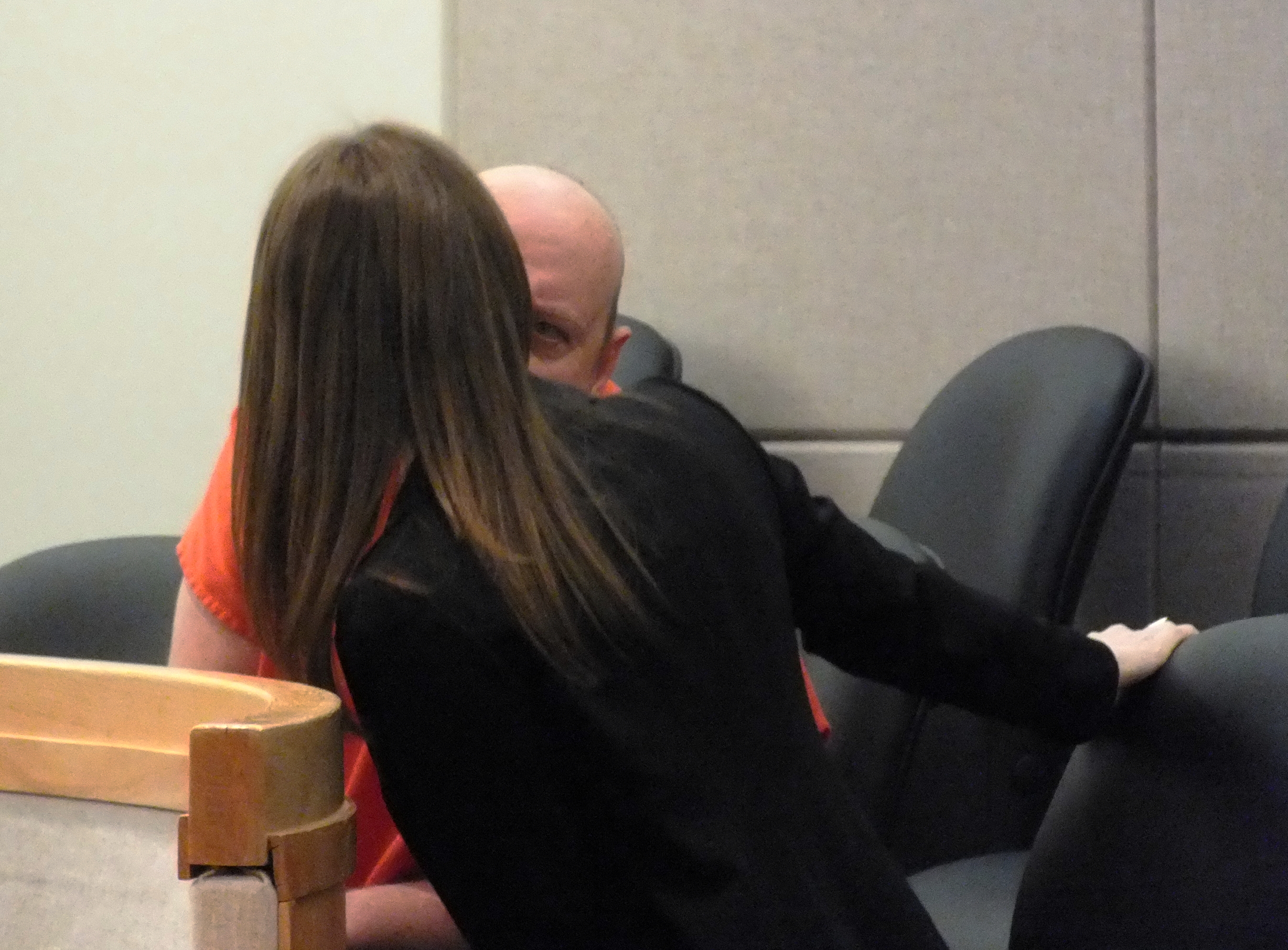 A defendant confers with his court-appointed defense attorney during an arraignment at the Dimond Courthouse in Juneau. (Photo by Matt Miller, KTOO - Juneau)