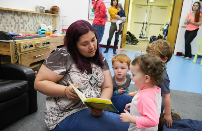 Gehring Nursery School worker Allison Cadiente-Laiti-Blattner reads to a group of children. (Photo by Lakeidra Chavis, KTOO - Juneau)