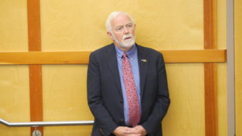 University of Alaska Southeast Chancellor Rick Caulfield listens to President Jim Johnsen’s presentation in the Egan Lecture Hall on Tuesday, Sept. 13, 2016. (Photo by Quinton Chandler, KTOO - Juneau)