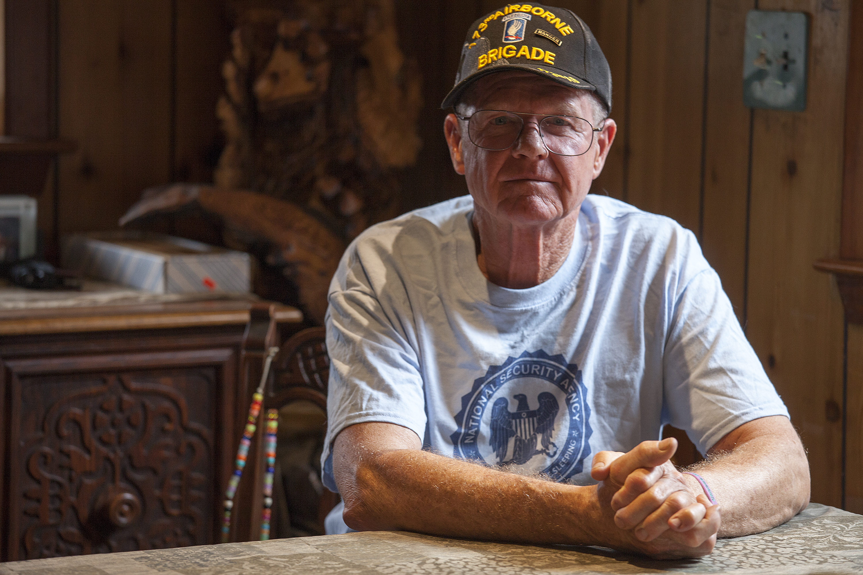 John Suter sits in his dining room in Chugiak. His appeal with the Alaska Ombudsman’s office has been ongoing for more than a decade. (Photo by Rashah McChesney, KTOO - Juneau)