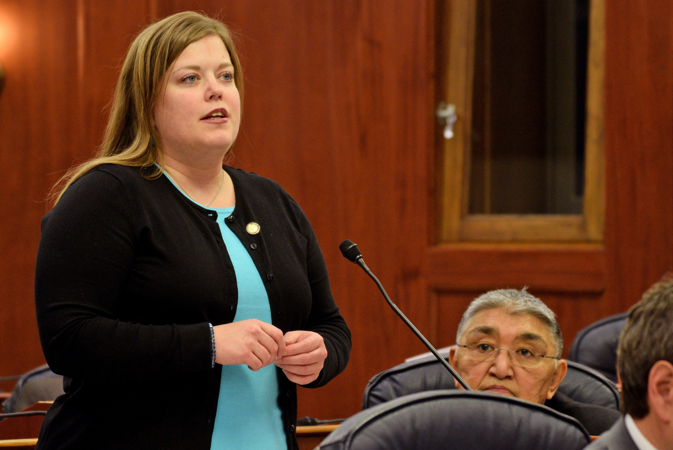 Rep. Geran Tarr addresses the Alaska House of Representatives in 2014. Tarr and Andy Josephson will replace Benjamin Nageak (seated, right) and David Talerico as the co-chairs of the House Resources Committee. (Photo by Skip Gray, Gavel Alaska)