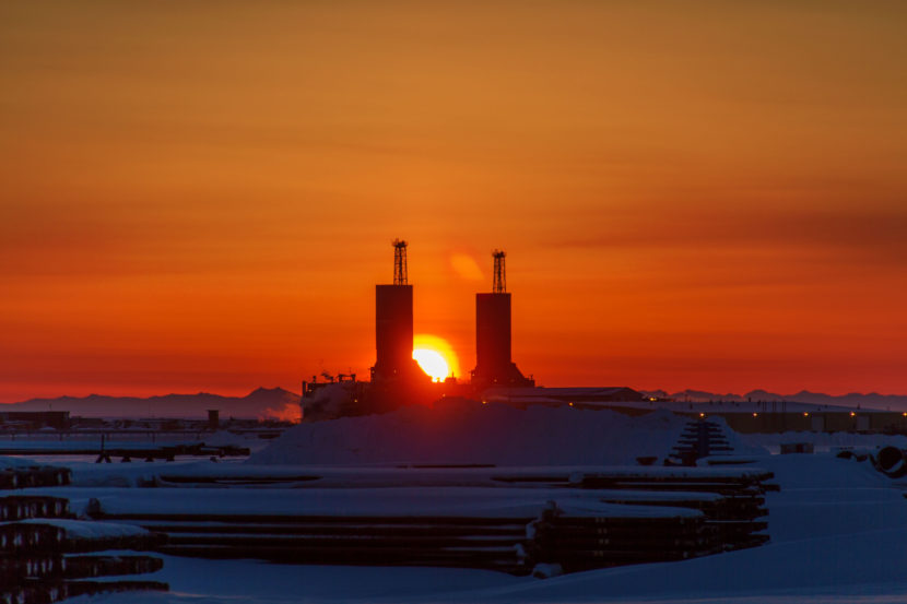 The sun rises on the North Slope between drill rigs, Nov. 6, 2012. (Creative Commons photo by Kevan Dee)