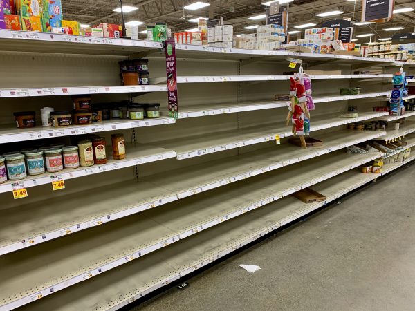 Barren shelves in a grocery store.