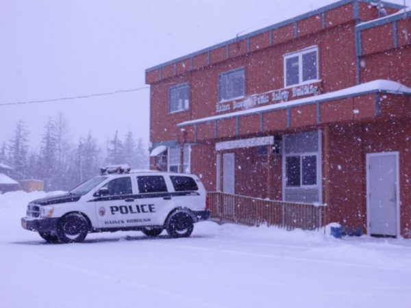 a building with a police car outside