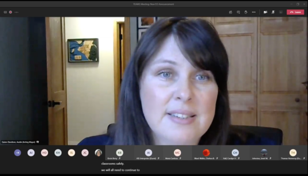 A woman talks on a video chat.