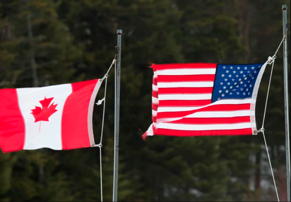 A canada flag next to a us flag
