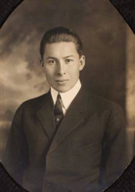 A man in a suit in a sepia colored photo