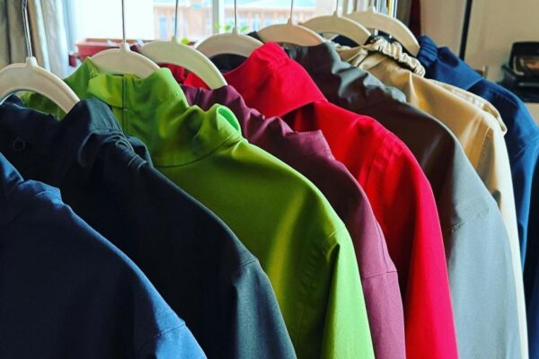A rack of colorful jackets.