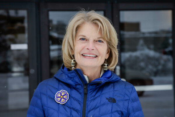 Sen. Lisa Murkowski poses for a photo outside the Division of Election office in Anchorage