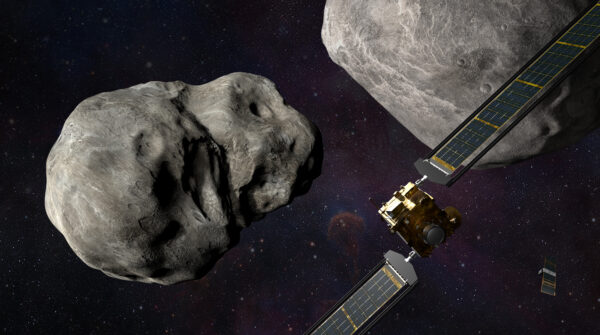 An illustration of the DART spacecraft approaching two asteroids.
