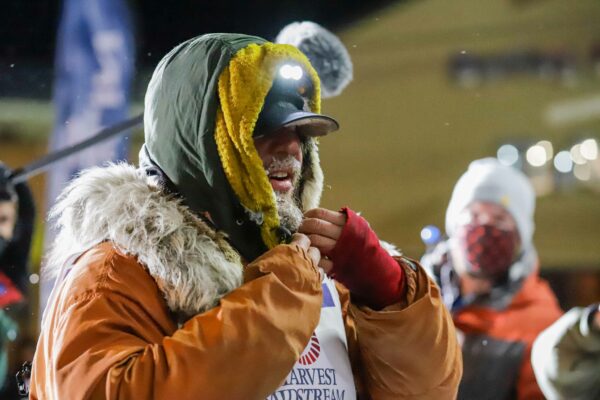 a musher arrives in nome