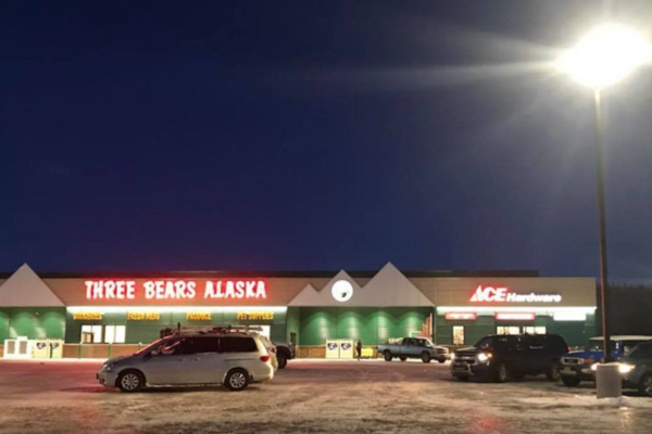 A Three Bears Alaska store, photographed from its parking lot at night.