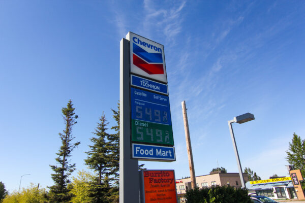 A gas station sign showing gas prices