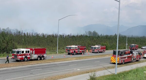 fire trucks near mountains
