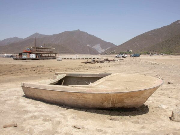 a dusty boat in mud